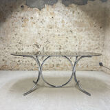 Smoked glass oval table from the 1970s.