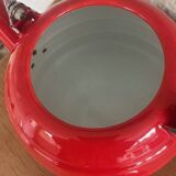 Old red enameled kettle