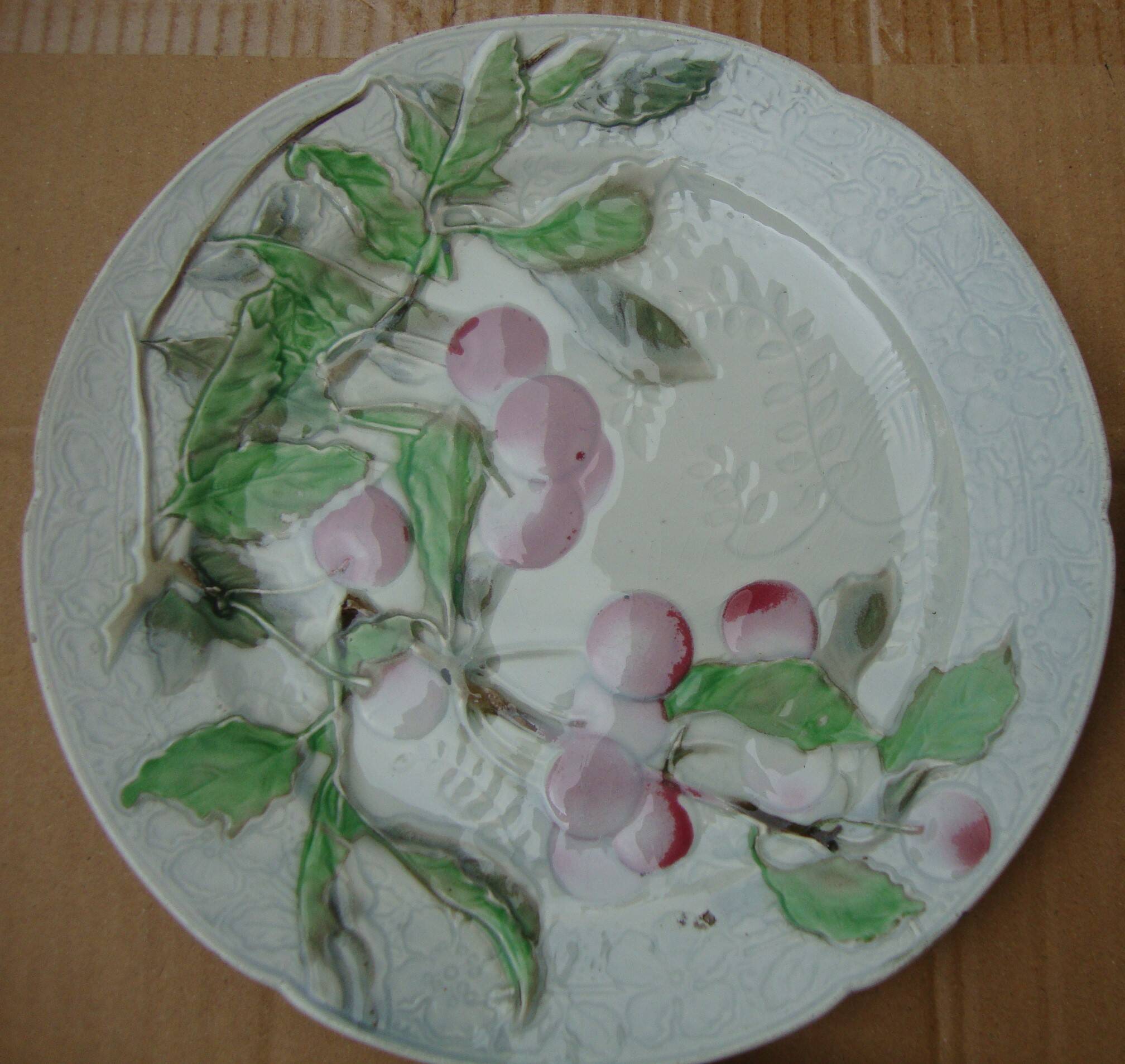 Set of 4 Keller and Guerin St Clement Majolica plates with fruit decoration.