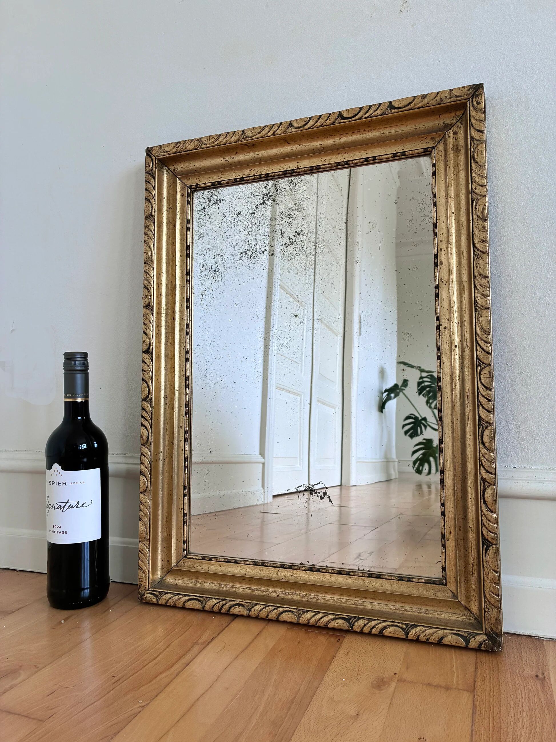 Antique French giltwood wall mirror in gold