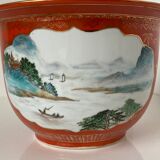 Chinese planter or Chinese porcelain pot cover decorated with landscapes on a coral and golden background