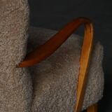 Pair of Mid Century Modern Swedish lounge chairs in birch and lamb's wool, 1960s.