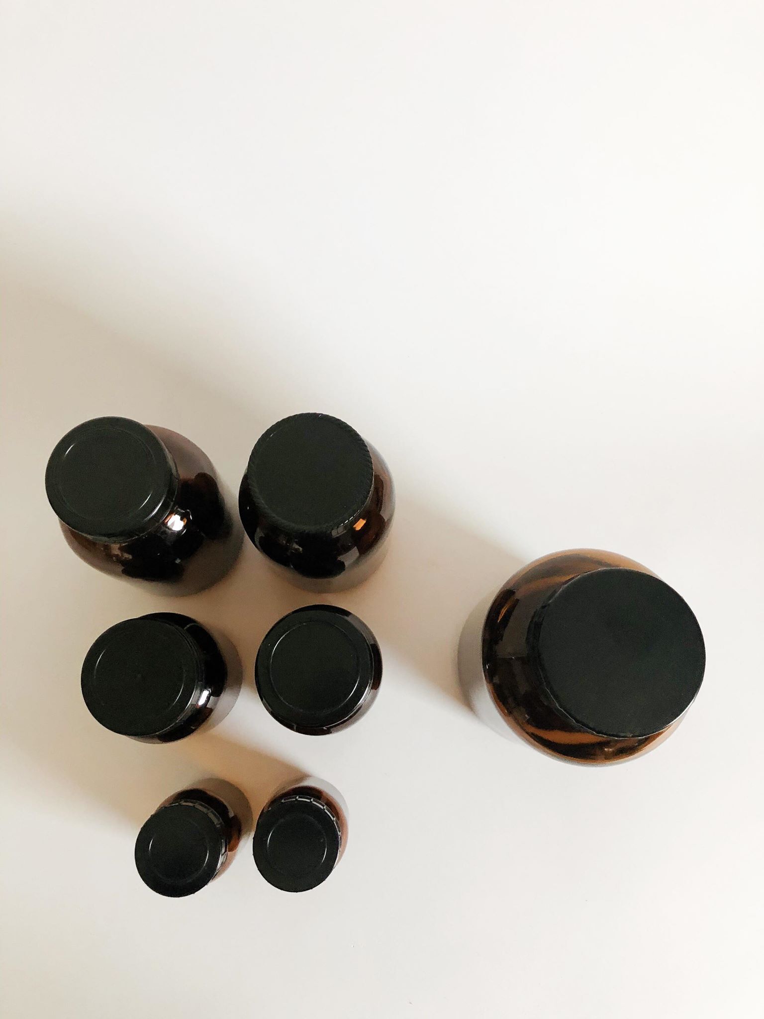 Lot of 7 bottles of amber glass apothecary style