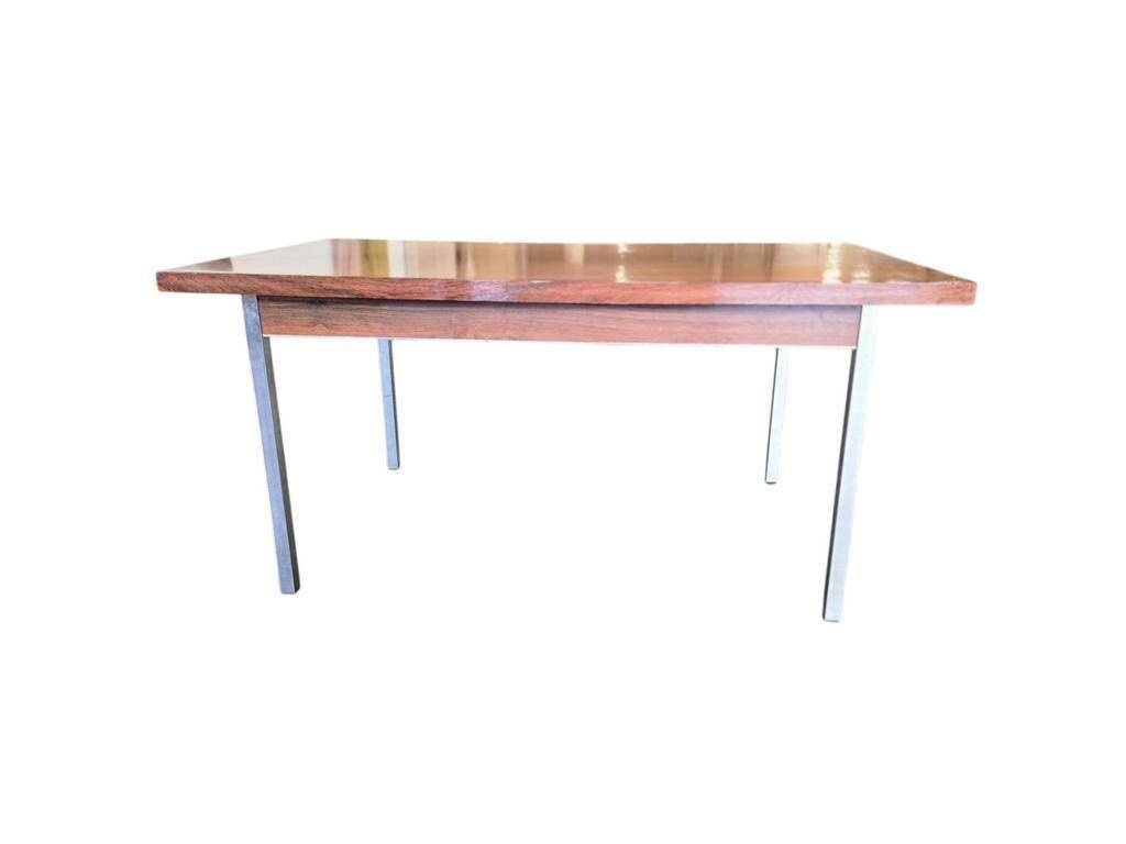 Vintage wooden dining table with chrome frame.