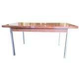 Vintage wooden dining table with chrome frame.