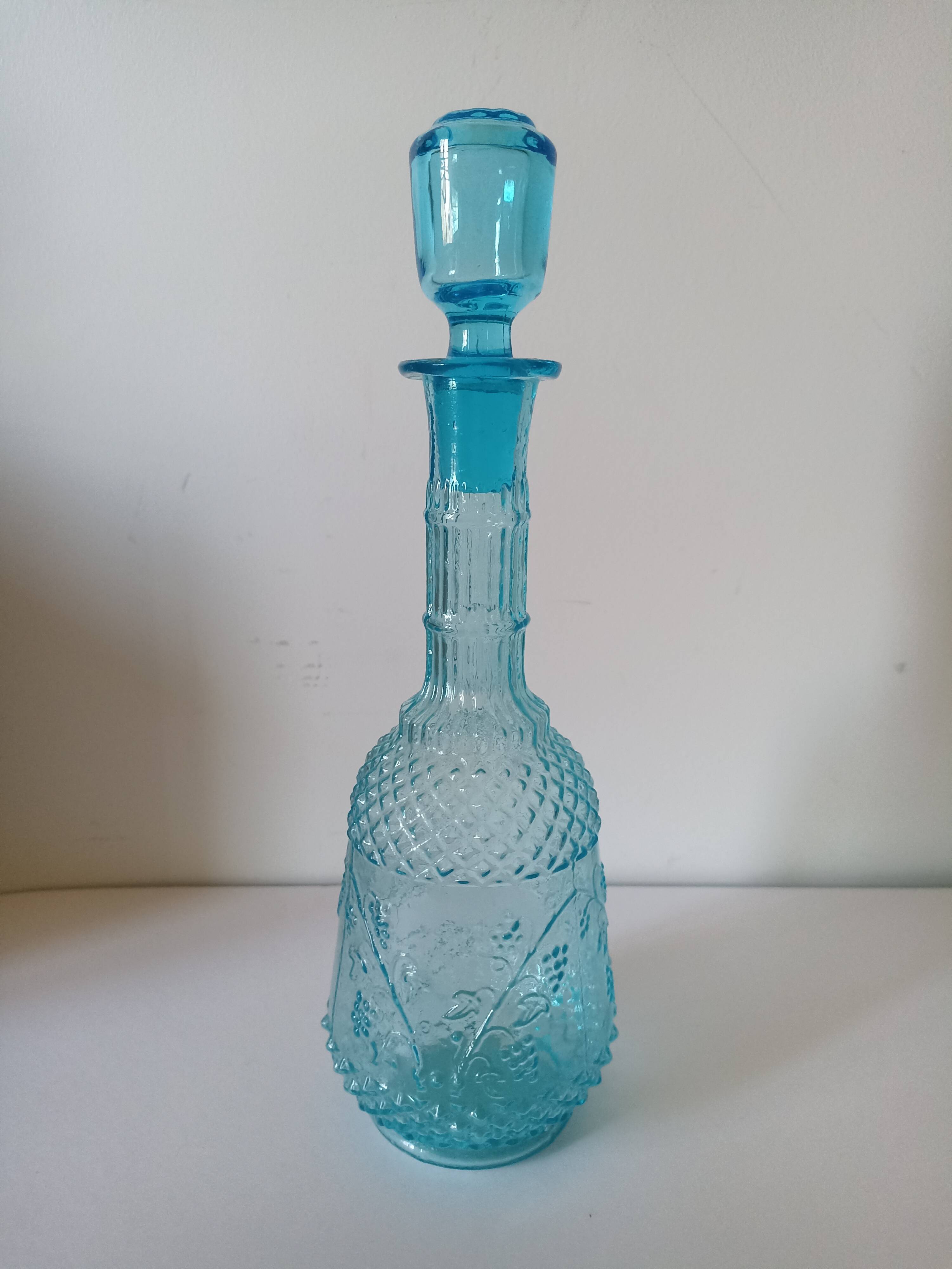 Old turquoise blue molded glass liqueur bottle and its cap