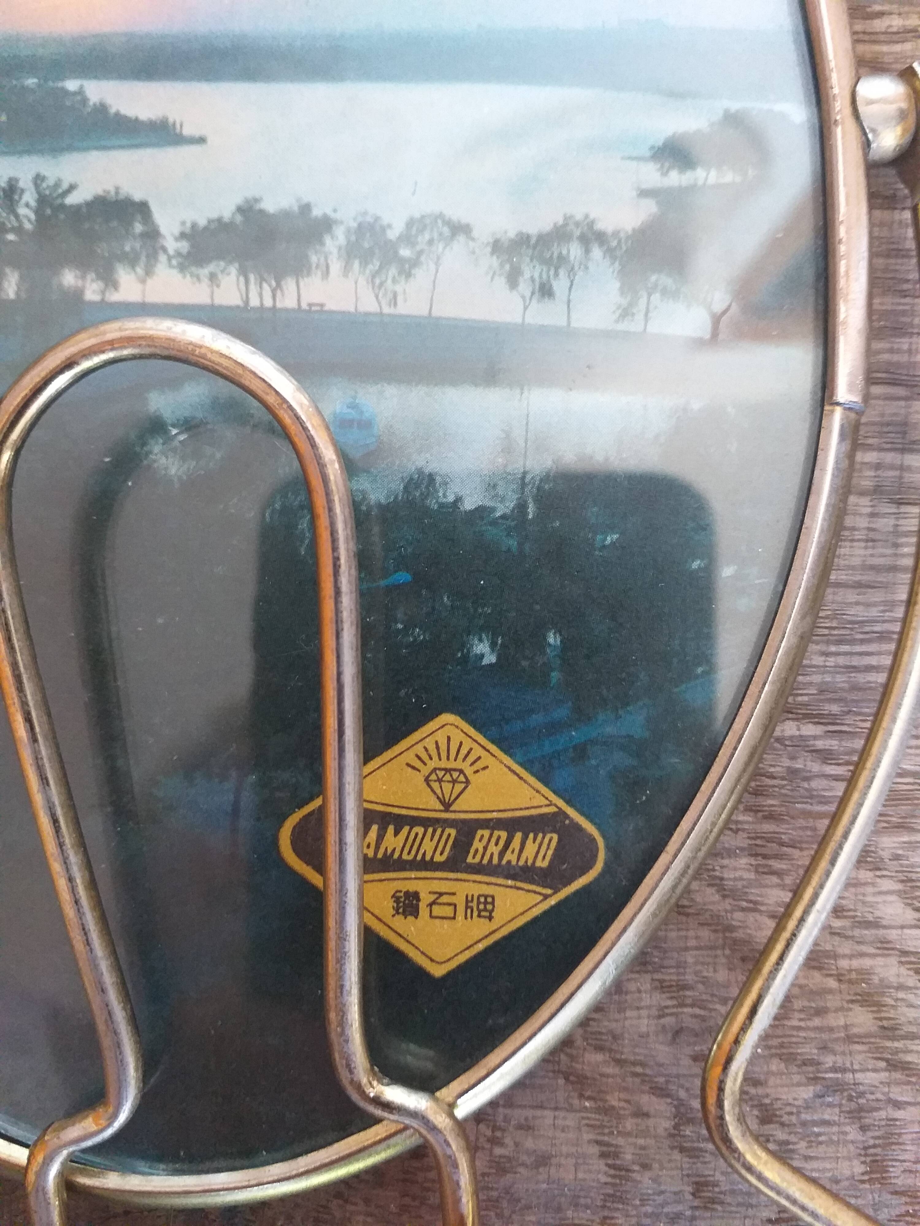 Vintage oval mirror on suspended stand