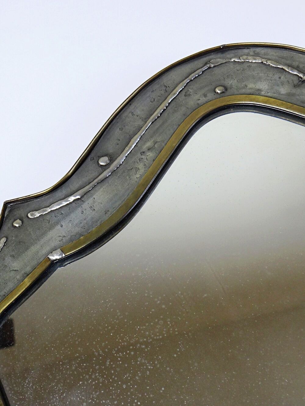 Brutalist mirror by Jean Goardère, brass and tin, 1970s.
