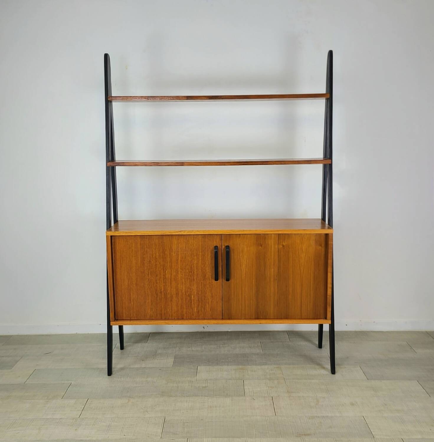 Vintage 1960s Scandinavian teak bookcase with compass legs