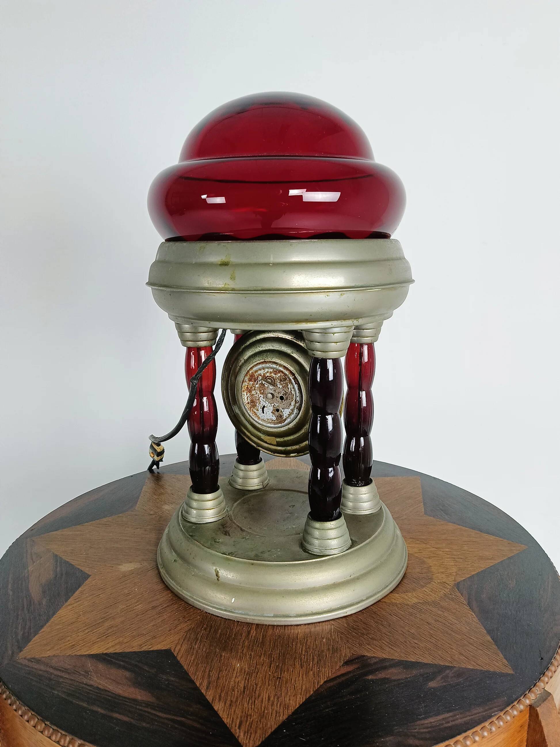 Unique vintage tin lamp with clockwork