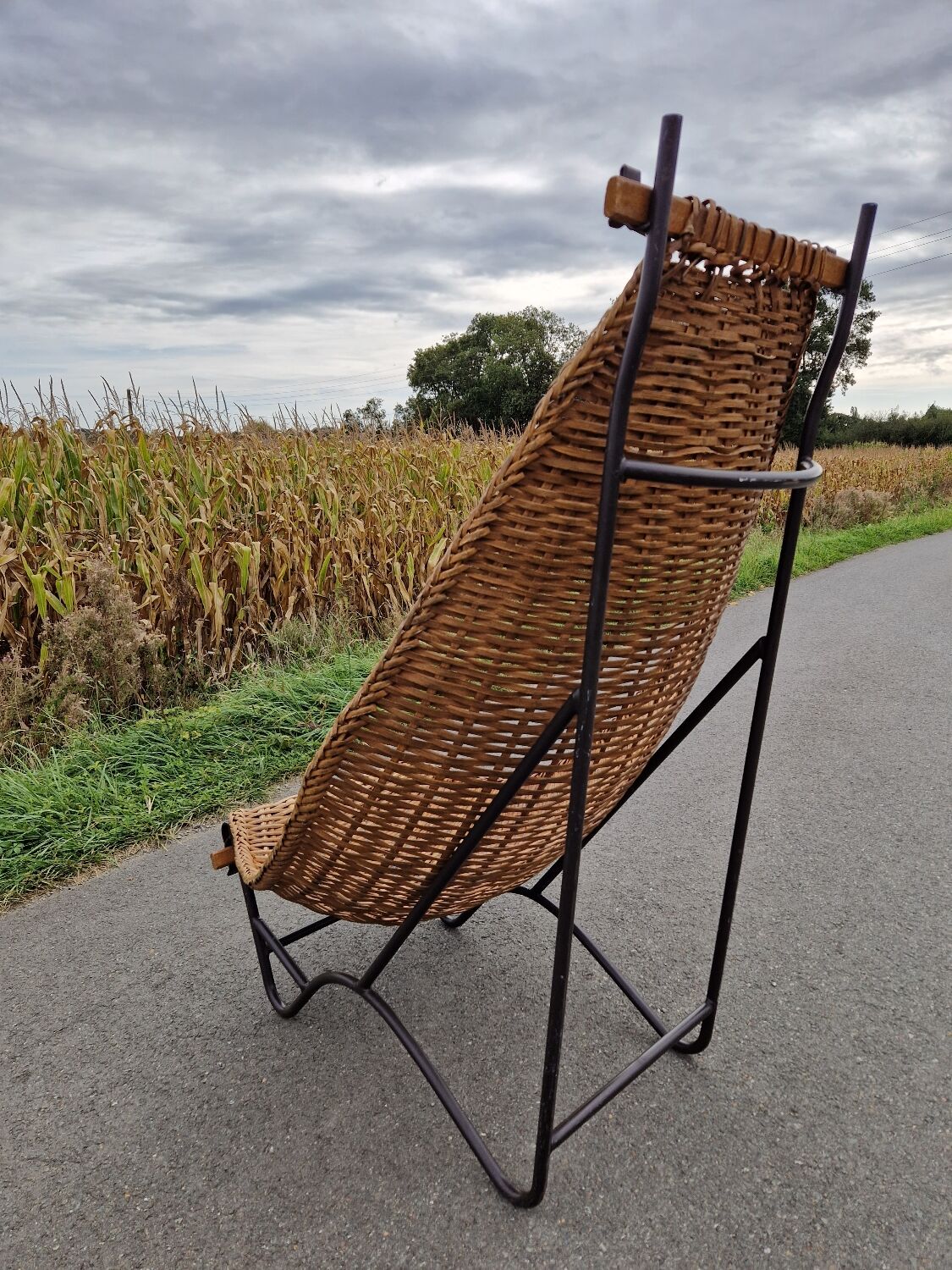 Large vintage metal and wicker armchair
