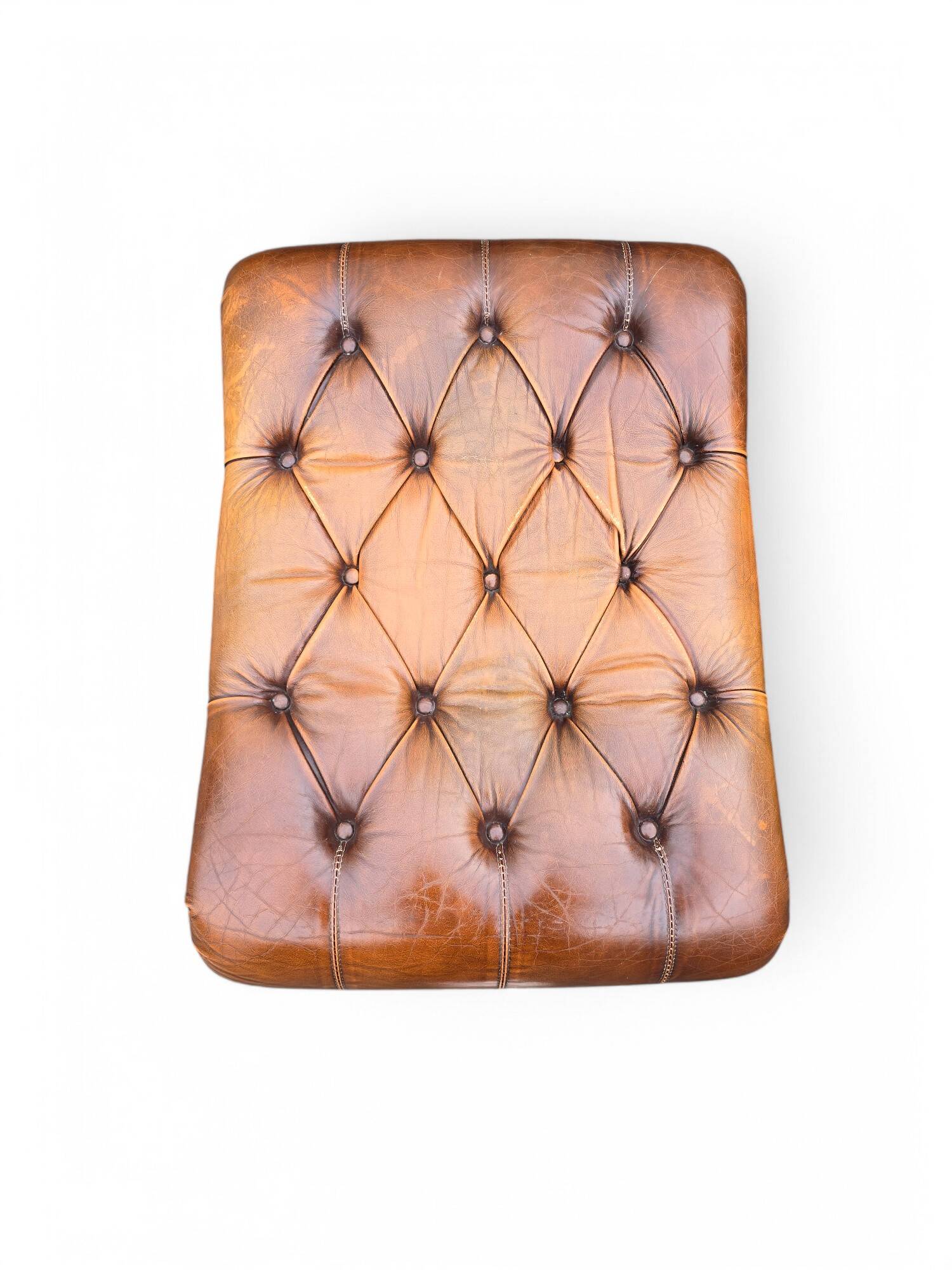 Pair of leather Chesterfields and footstools