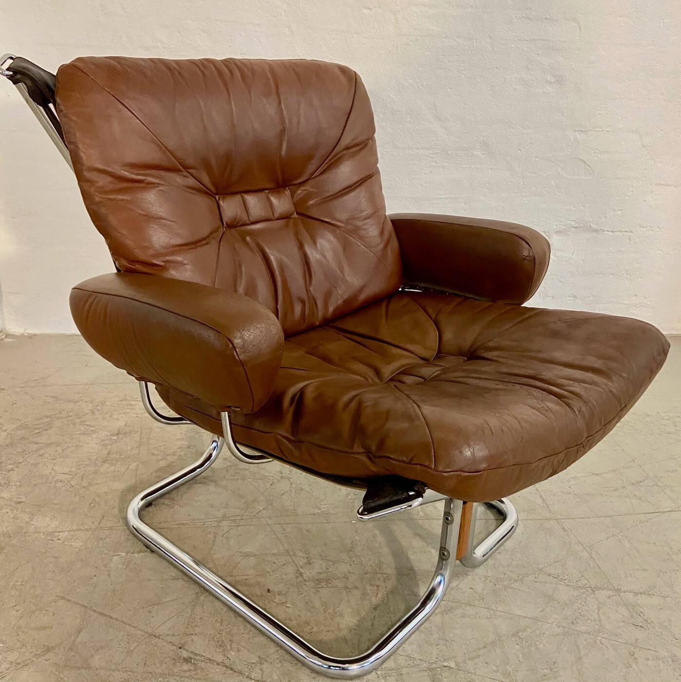 Vintage mid-century Scandinavian cognac leather lounge chair by Harald Relling