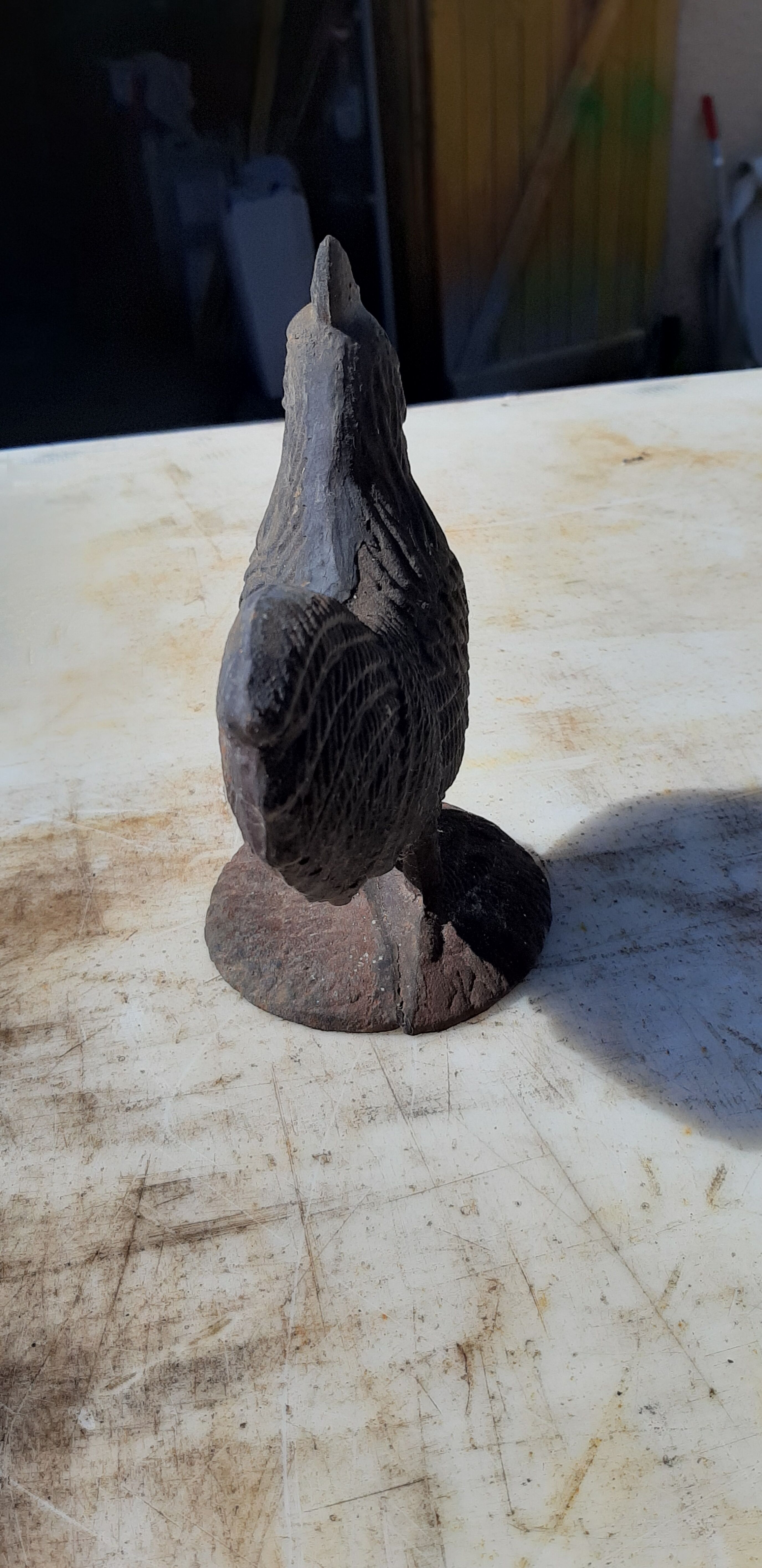 2 roosters and 2 cast iron birds