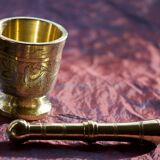 Mortar and its brass pestle with oriental gold and silver motifs