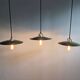 Trio of large industrial suspensions in green enamelled sheet metal.