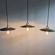 Trio of large industrial suspensions in green enamelled sheet metal.