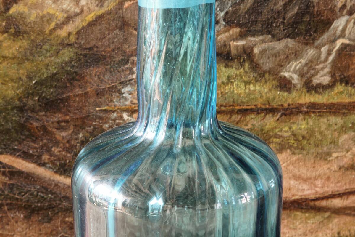 Large blown crystal bottle, twisted, turquoise blue, early 20th century.