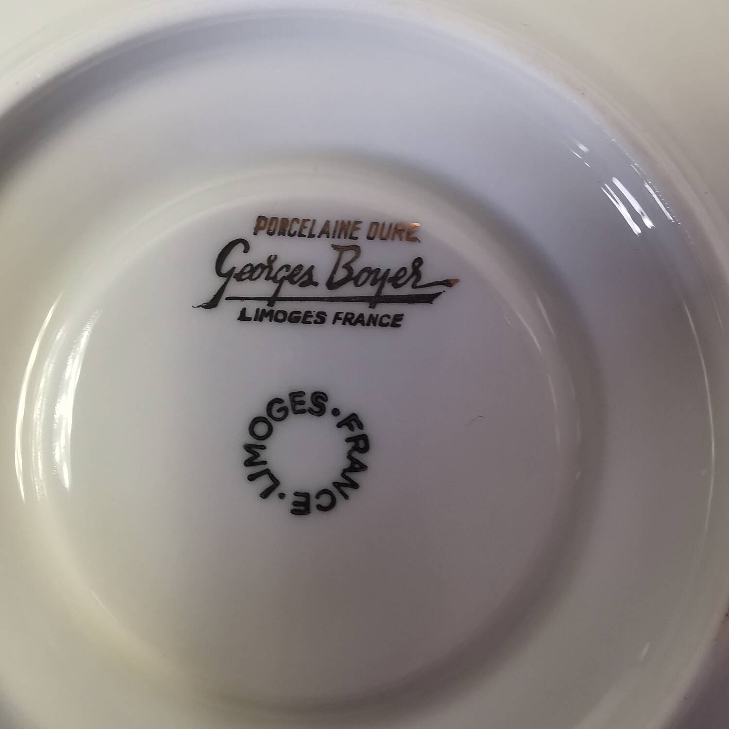 Set of 8 Georges Boyer Limoges porcelain saucers