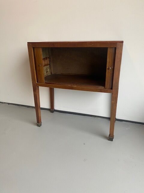 Old wooden cabinet with extendable doors