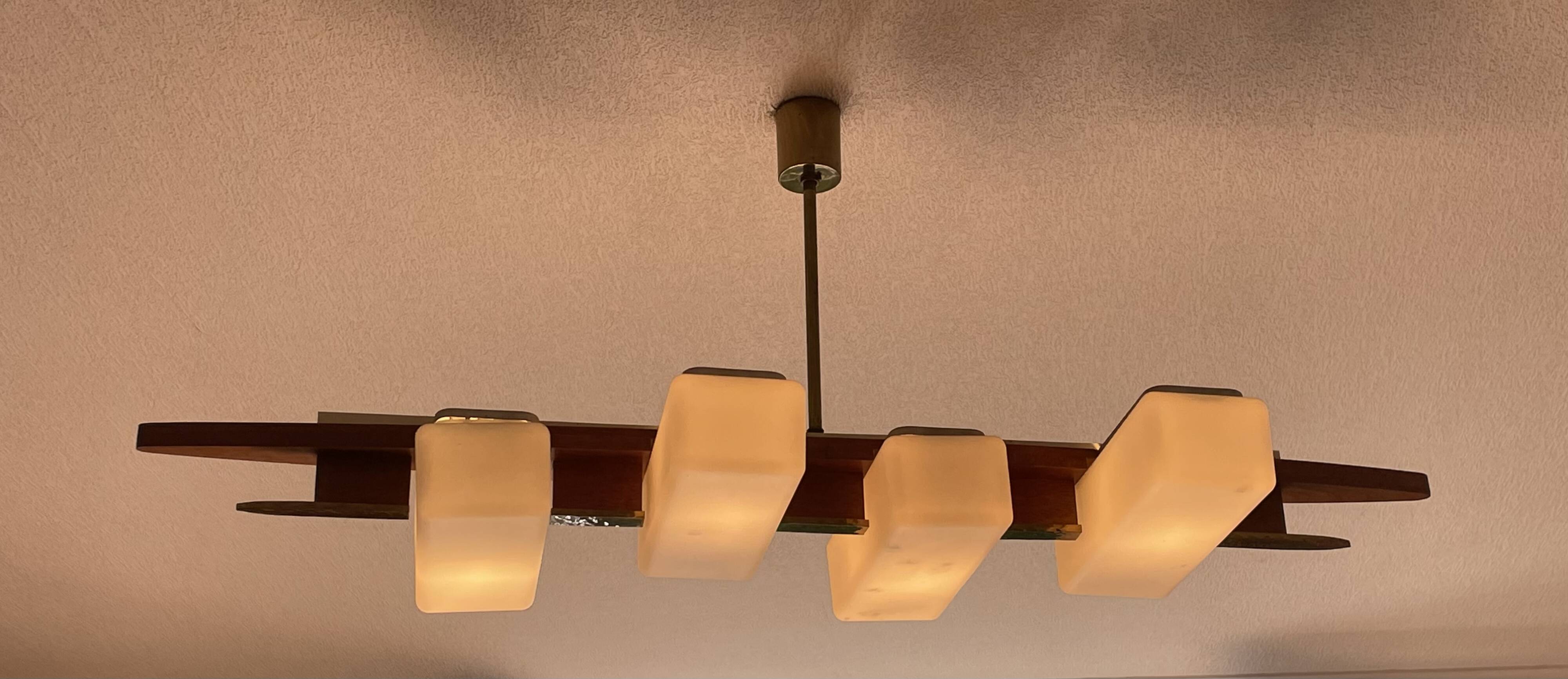 Scandinavian chandelier, brass, precious wood, 4 lights, shuttle 102 x 35 x 9 cm