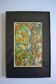 Framed abstract painting under glass