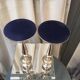 Pair of candle holders in sober and elegant silver metal