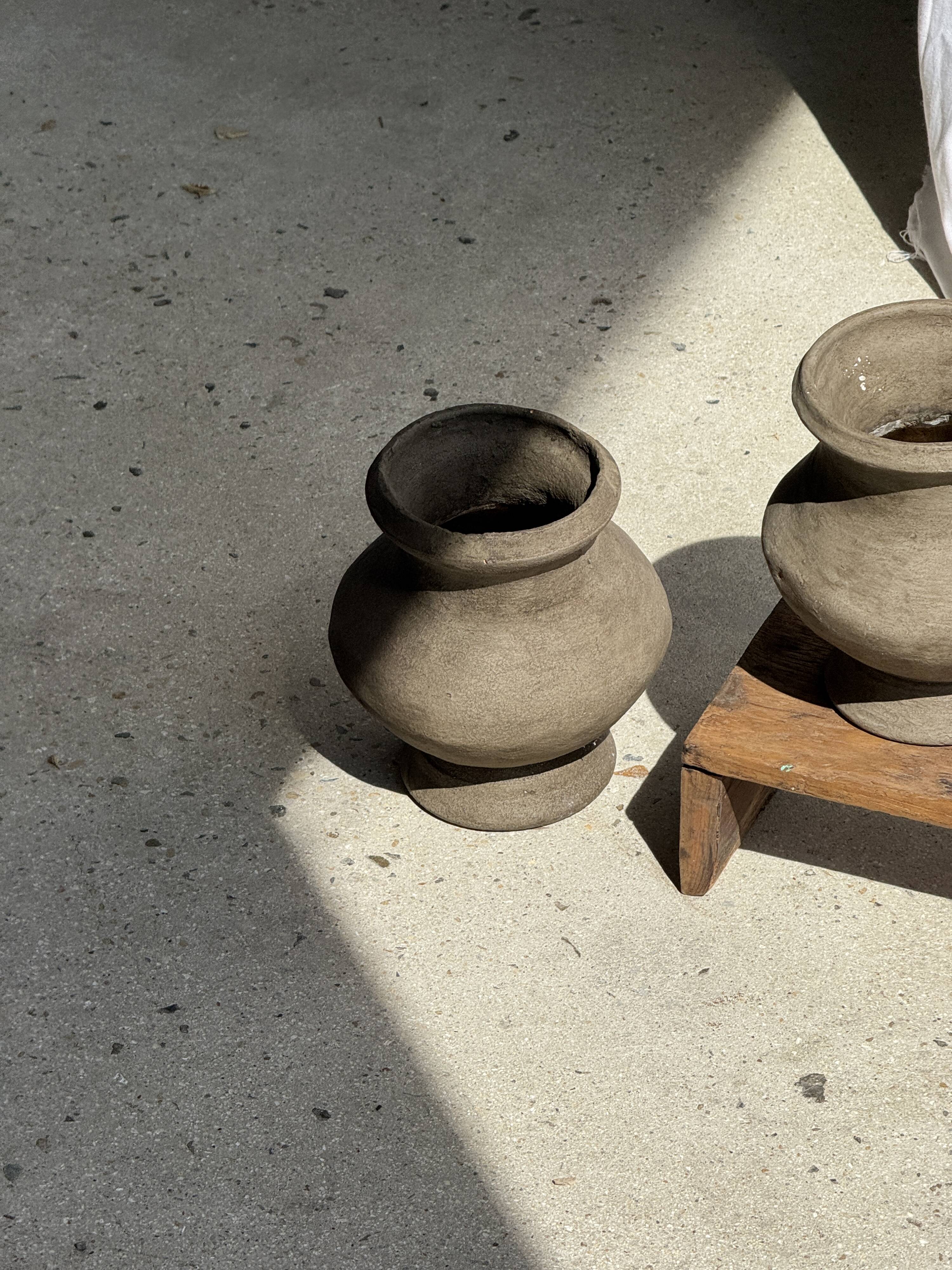 Small brutalist handcrafted terracotta vase with a pedestal, Indonesian, H19 D17.