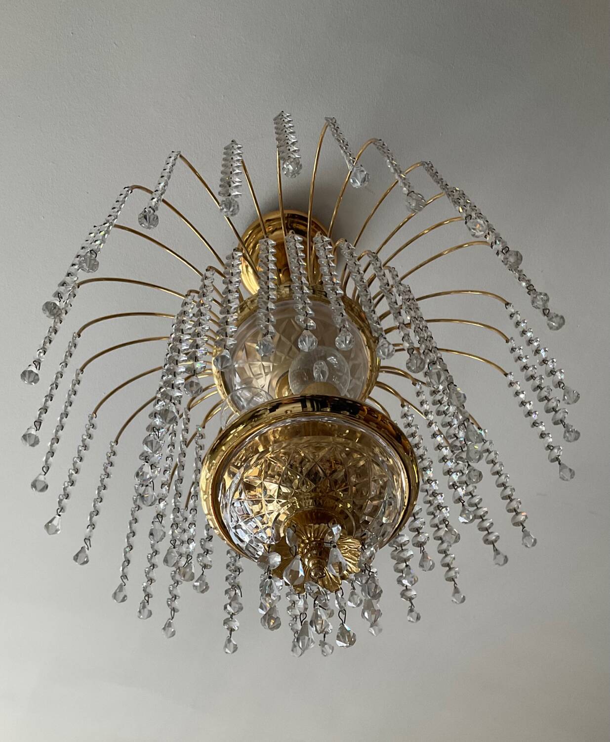 Brass waterfall chandelier with crystal tassels