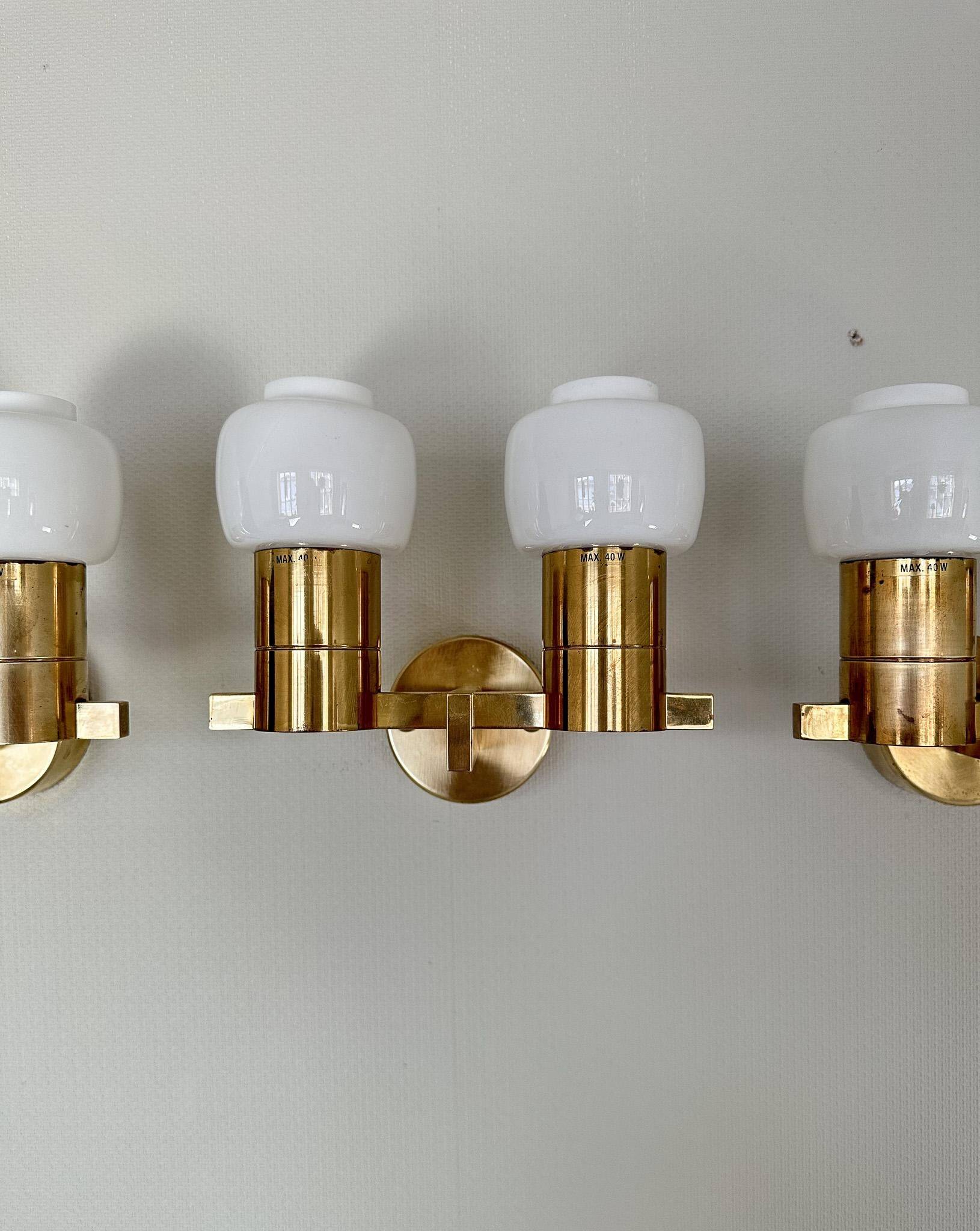 Brass and opaline glass wall lamps by Hans-Agne Jakobsson in mid-century style, Sweden, 1960s.