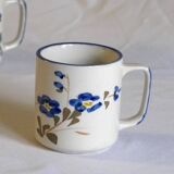 Set of 4 stoneware cups/mugs with blue floral designs, made in China.