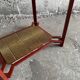 Vintage terracotta-red metal side table with glazed brown-green ceramic tile surfaces