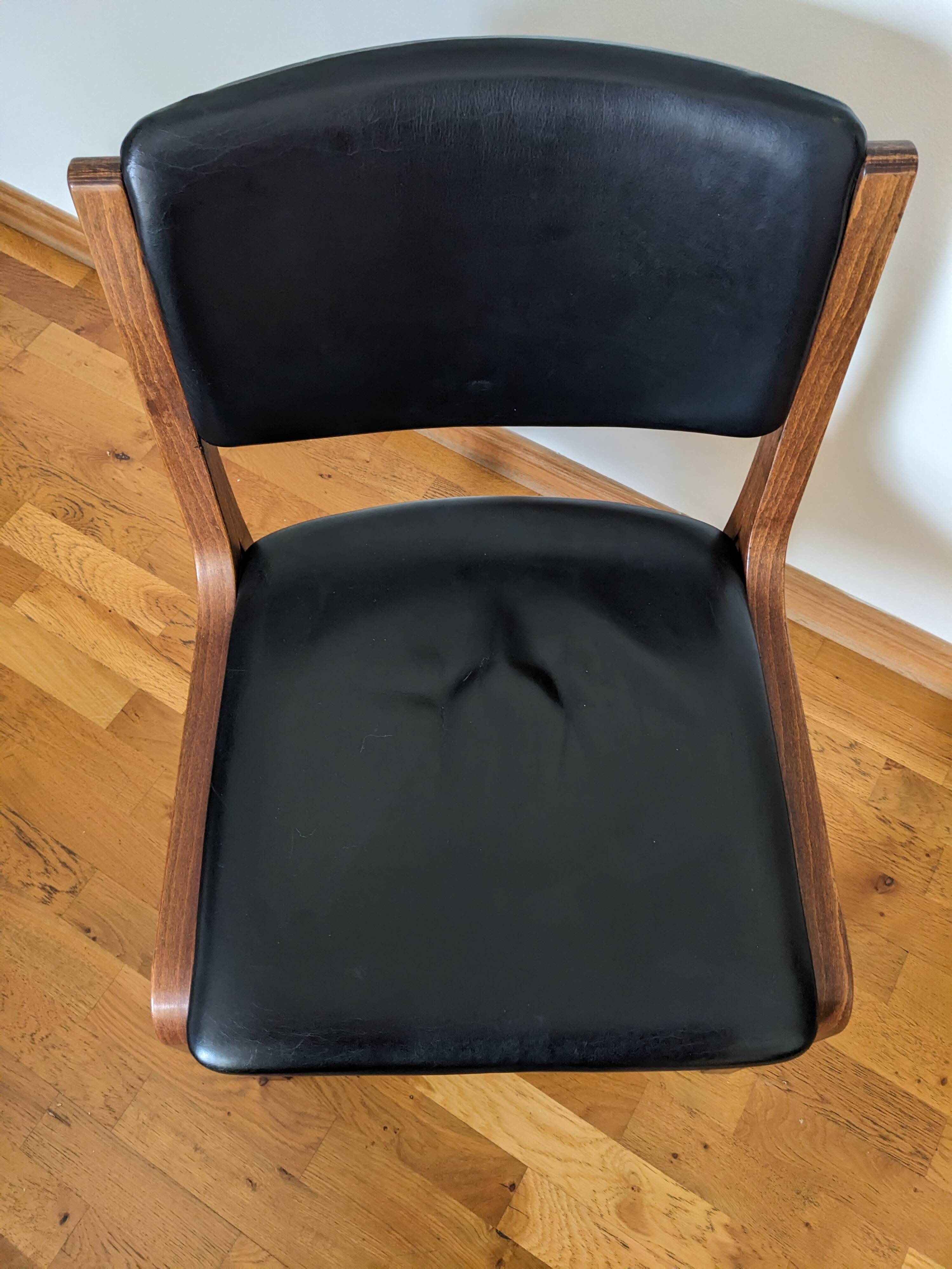 Vintage leather and wood chair pair