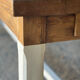 Farm table in solid oak - white patinated legs and its bench.