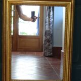 Empire period mirror, early nineteenth in gilded stucco wood H 72 cm
