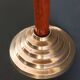 Two vintage wooden and brass candlesticks.
