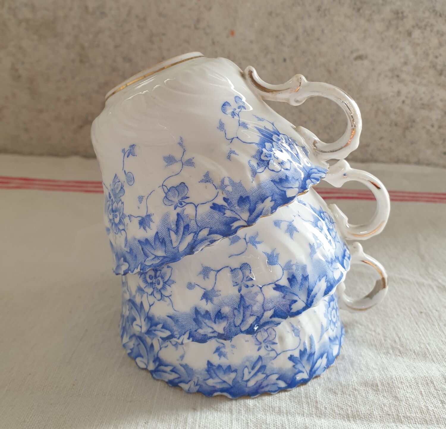 Trio of fine porcelain cups