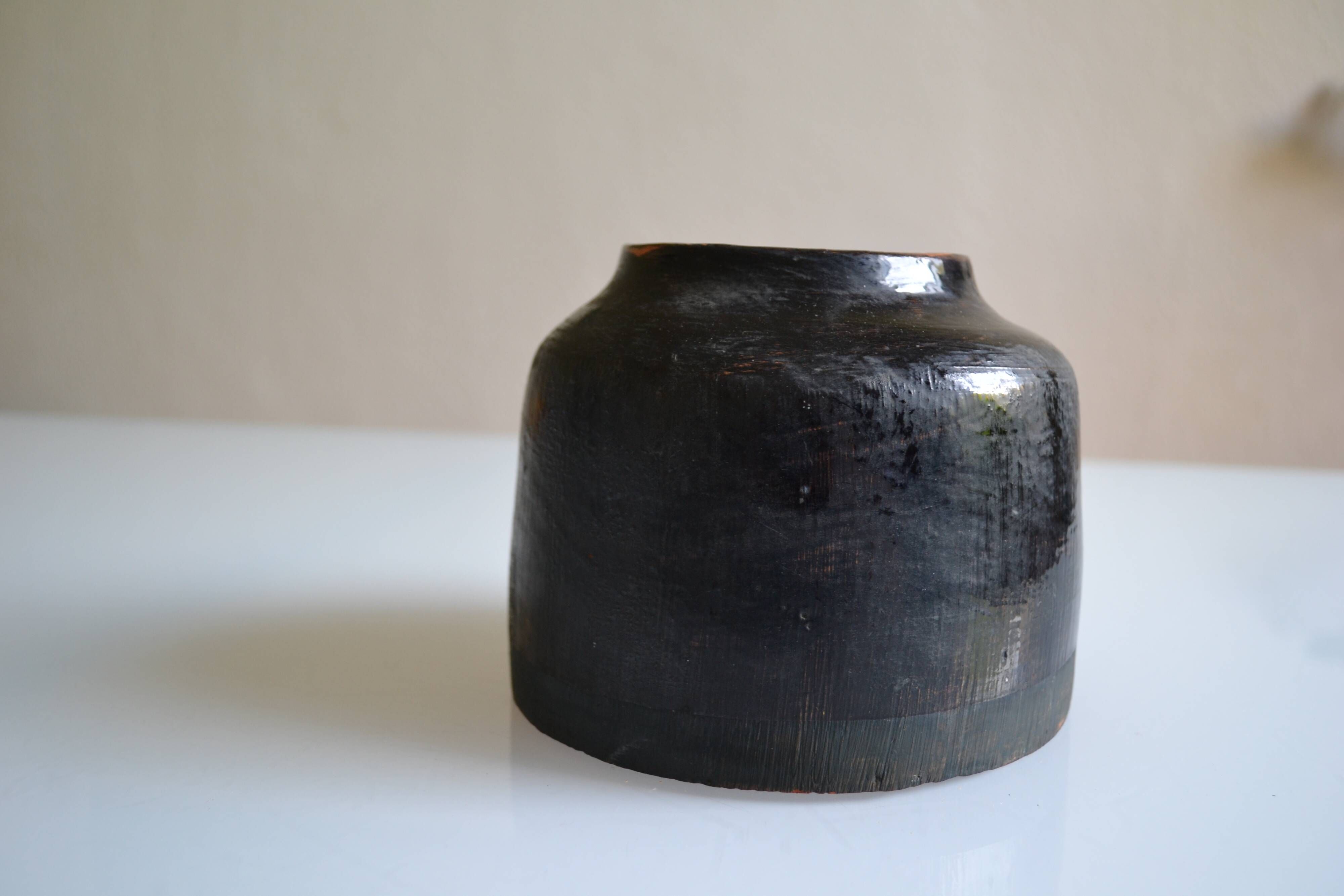 Ceramic vase with a signature fish to identify.
