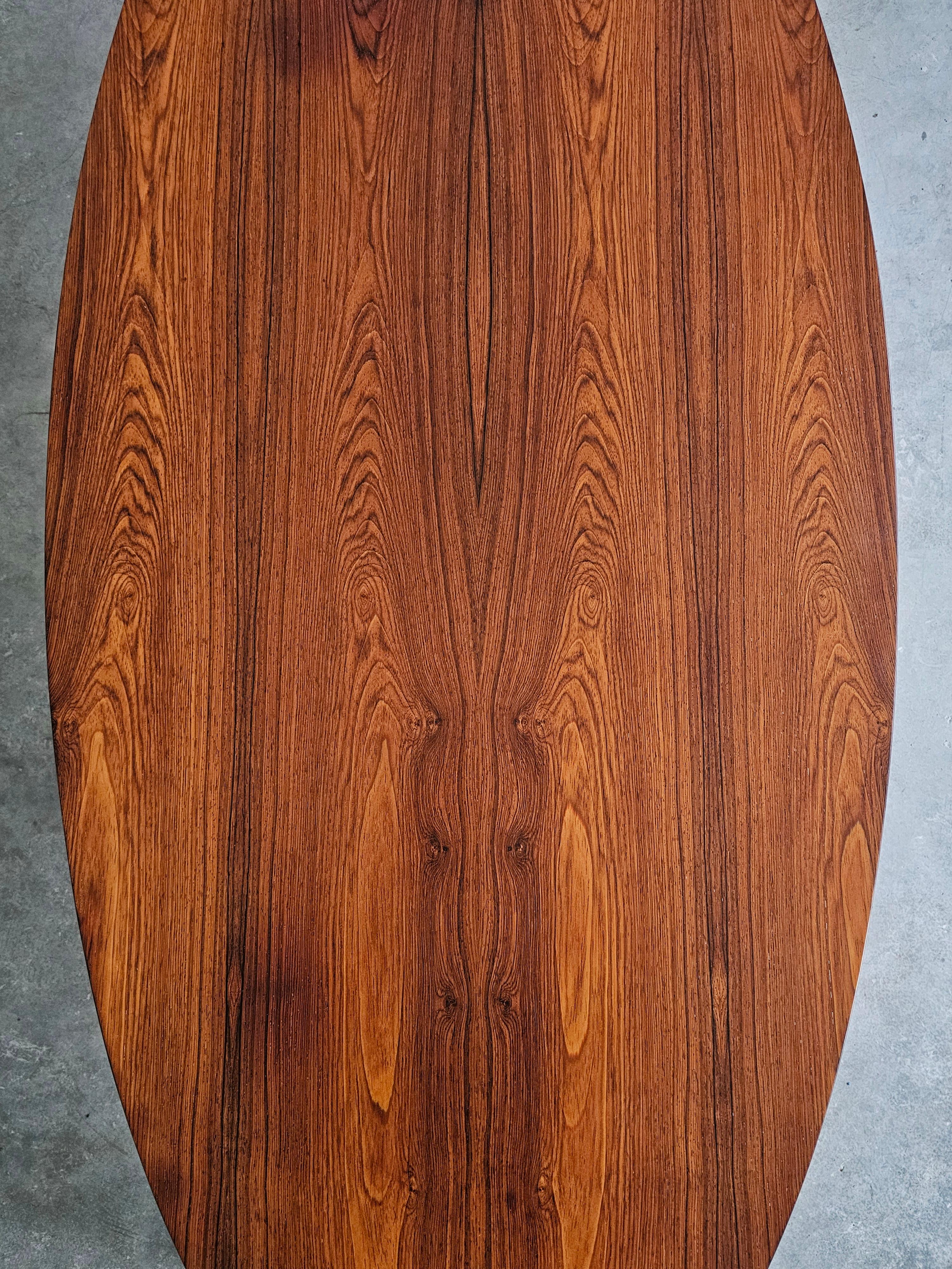 Danish Mid Century Modern oval coffee table with a teak top and chrome legs.