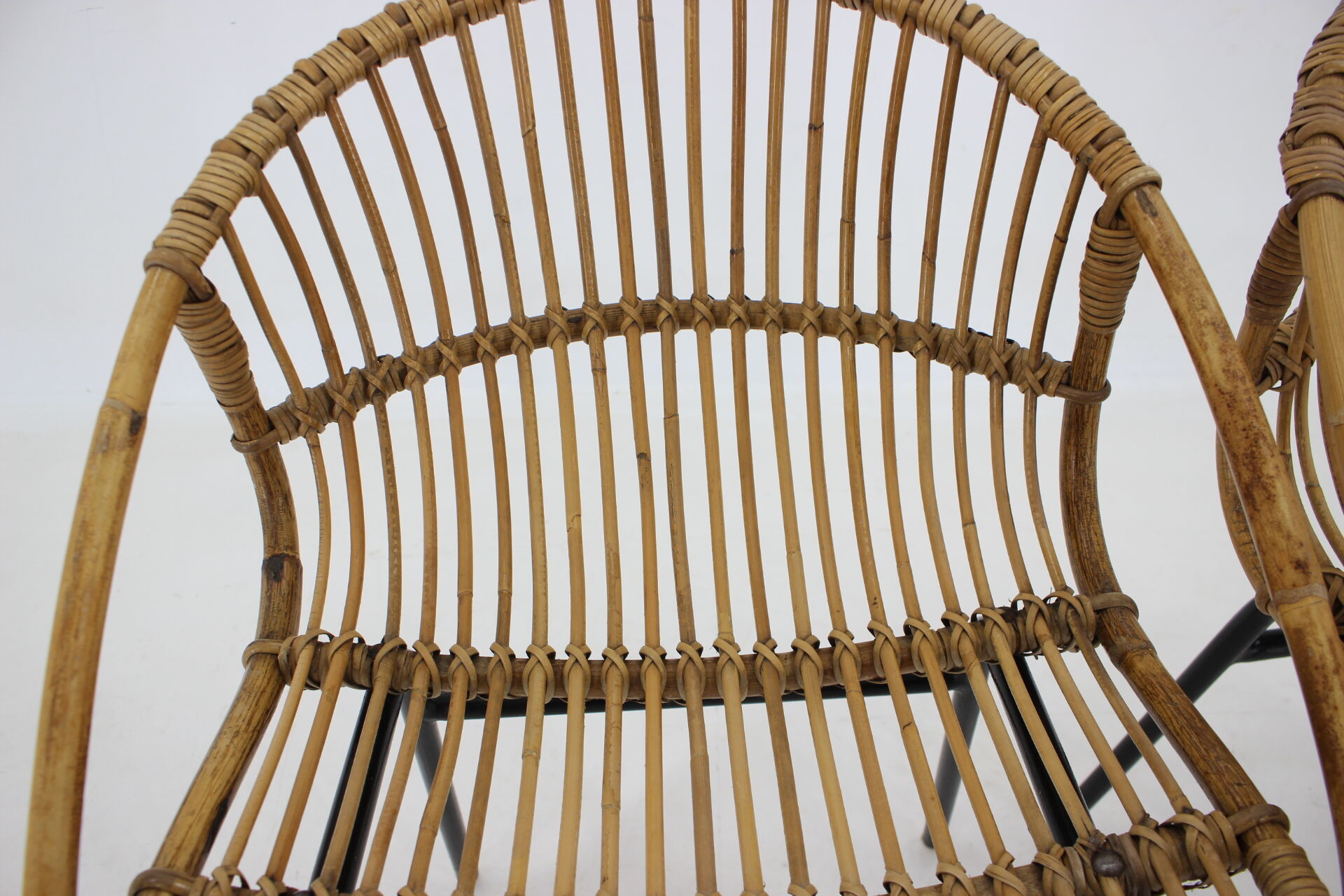 1970s pair of Alan Fuchs rattan and iron lounge chairs, Czechoslovakia