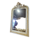 Patinated beige and gold mirror with an angel