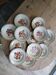 Set of 12 vintage deep plates with a burgundy caramel pattern.
