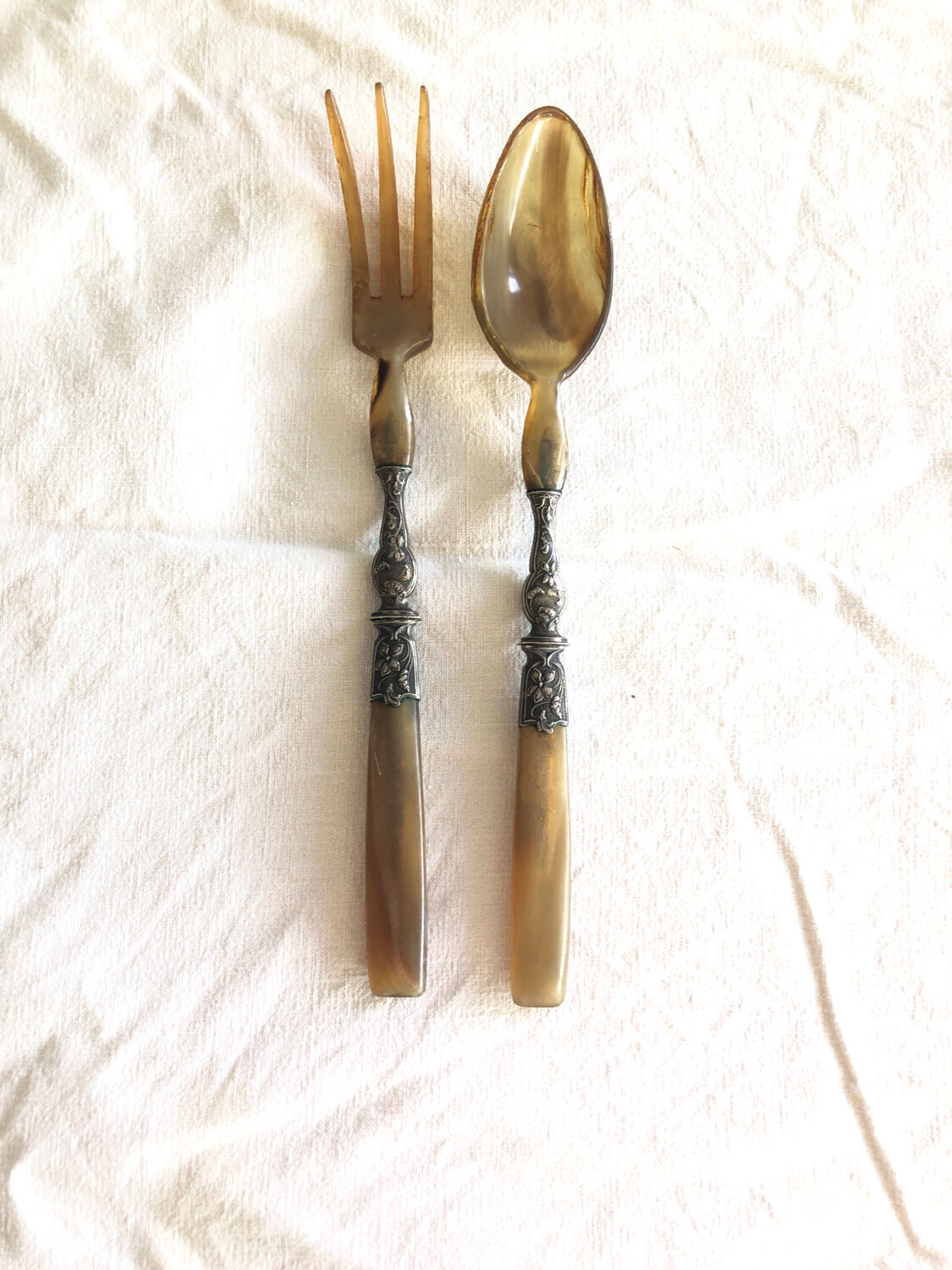 Old corn and silver salad cutlery
