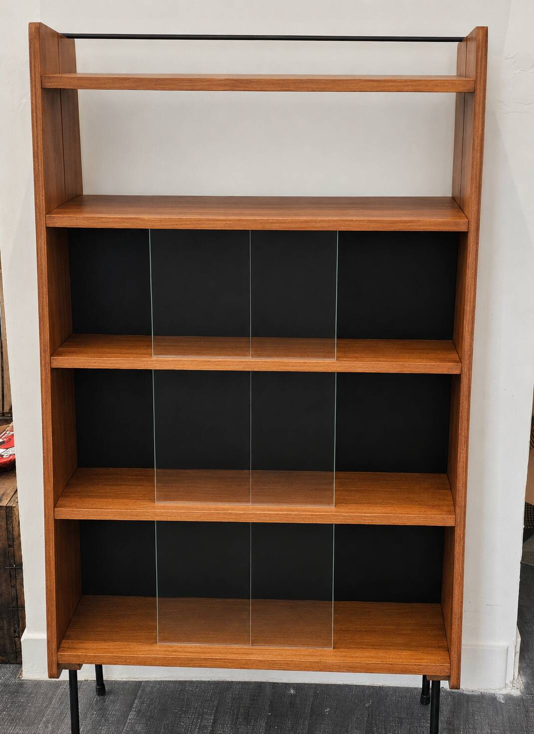 Modernist showcase library with sliding glass doors