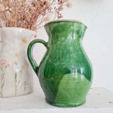 Antique green pitcher in painted terracotta
