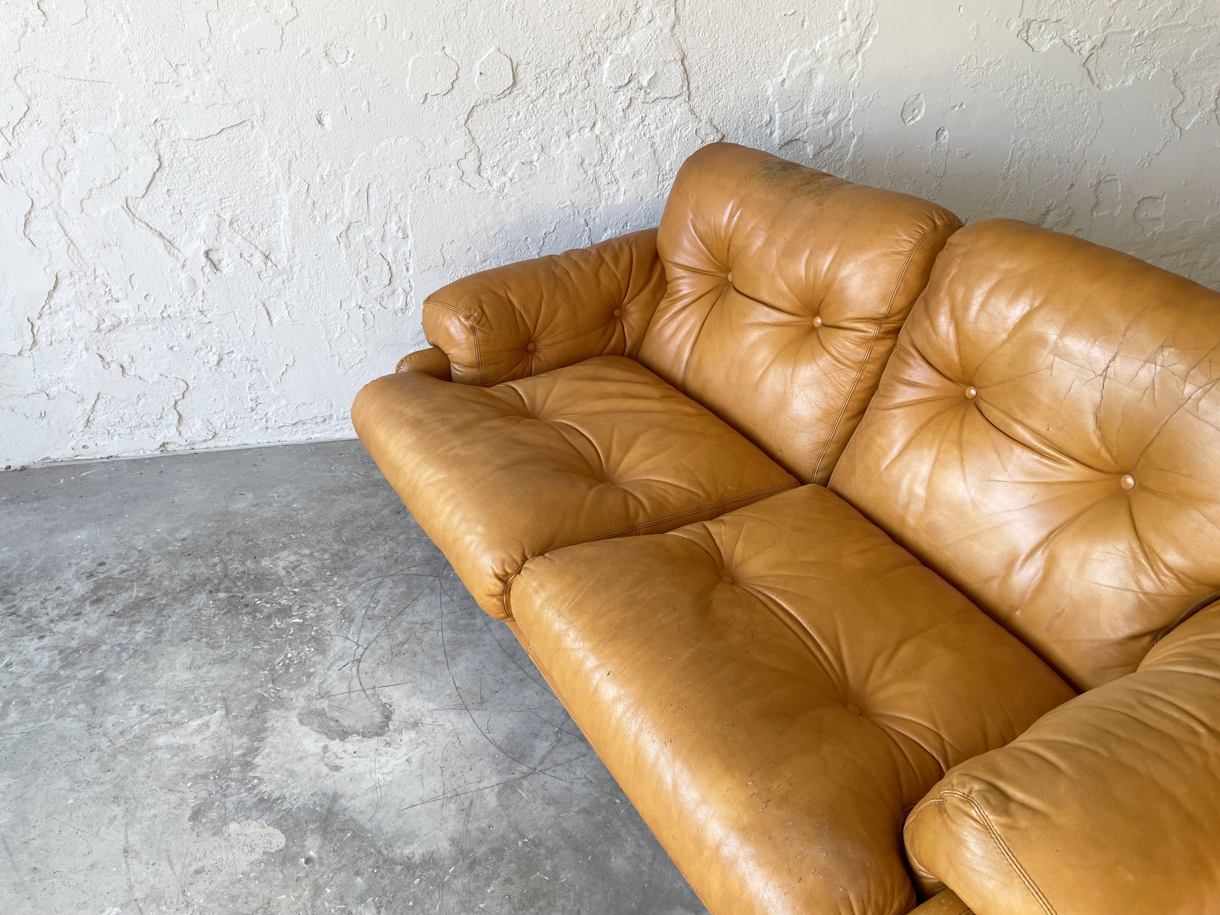 Two seats leather sofa, by Tobias Scarpa
