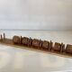 Six wooden egg cups and their rope holder
