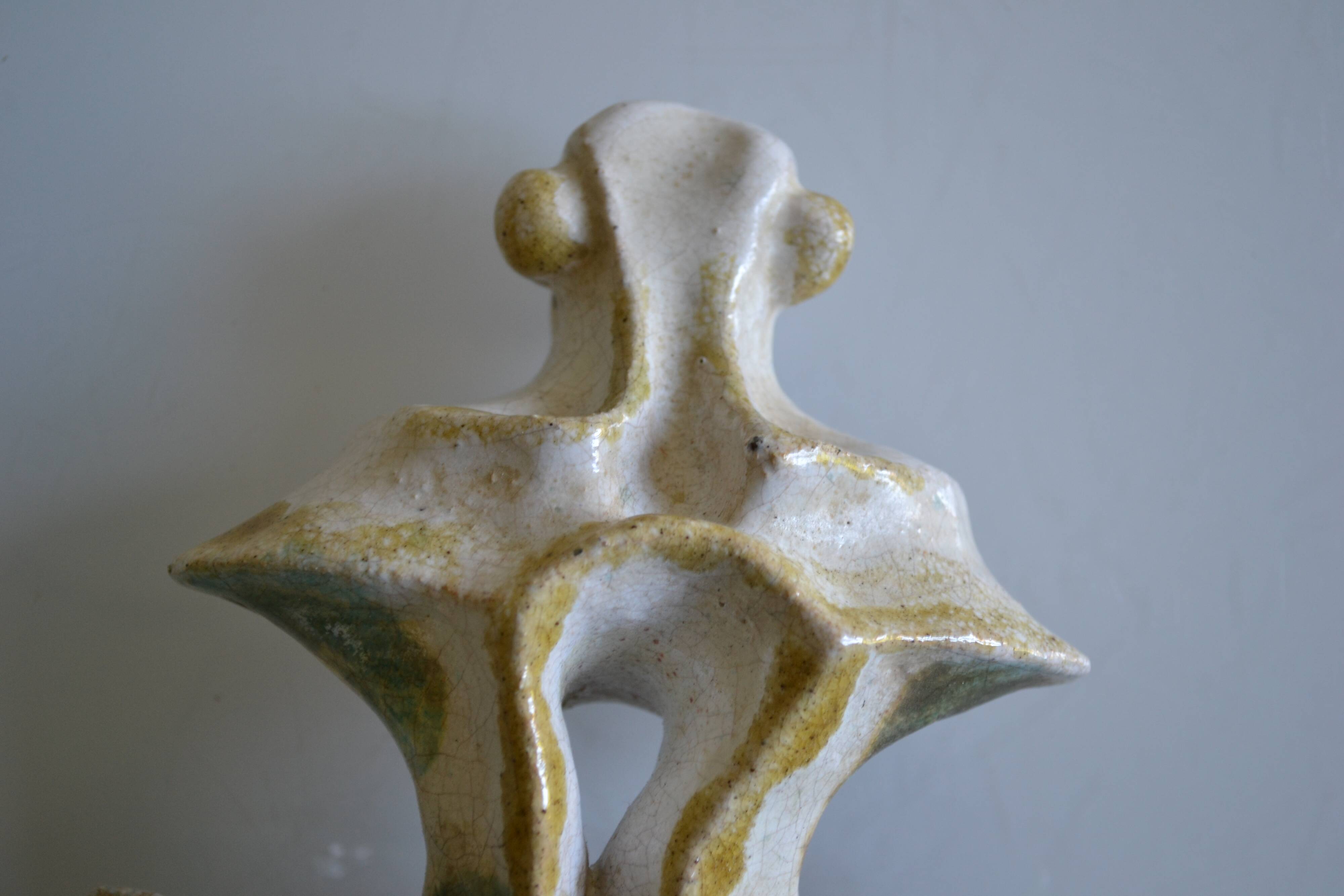 Surreal ceramic sculpture in relief signed to be identified.