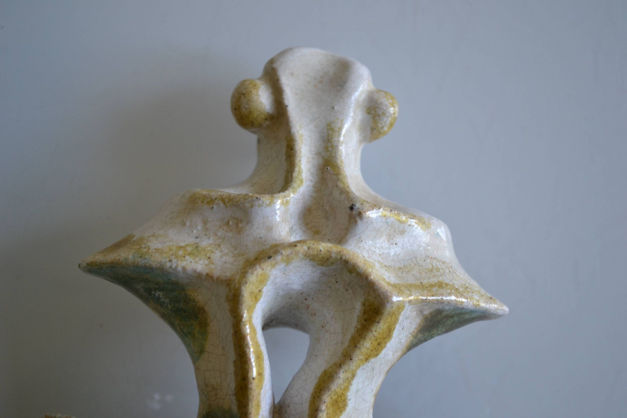 Surreal ceramic sculpture in relief signed to be identified.