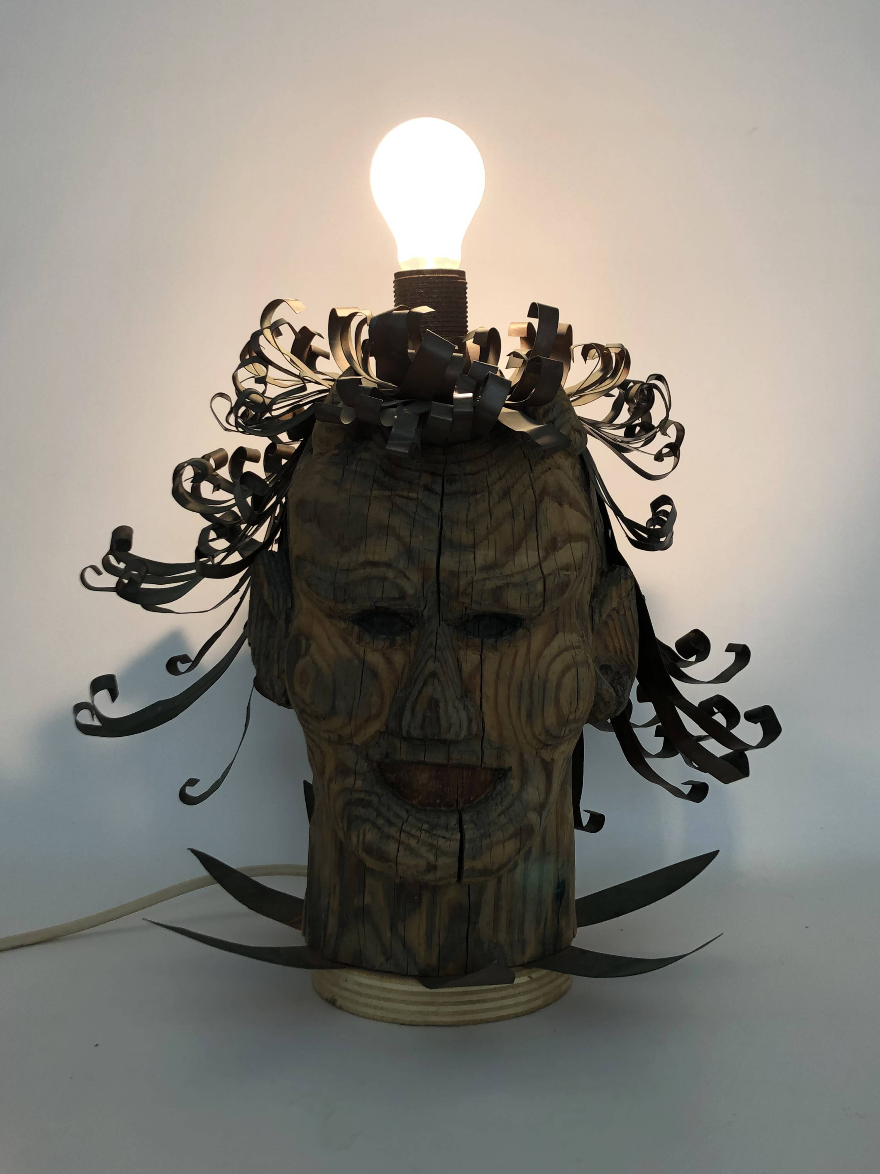 Unique piece. Wooden lamp and metal hair with devil's head "self-portrait"